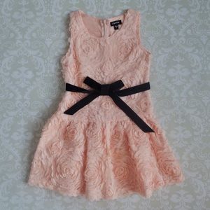 Salmon pink rosette dress with black velvet ribbon